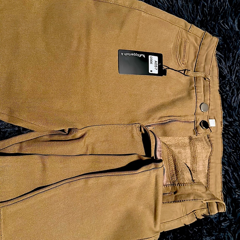 Khaki high waisted stretch pants.